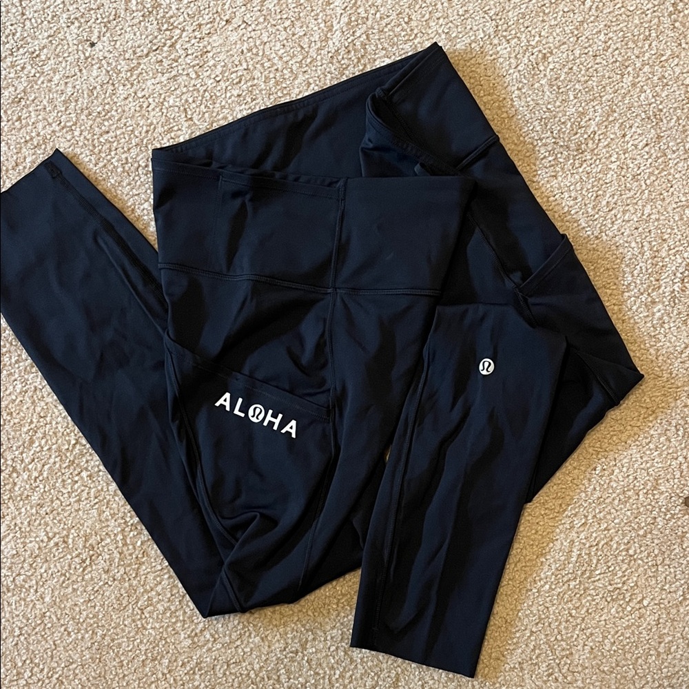 Black Lululemon Fast and Free High Rise “Aloha” Leggings, 23”